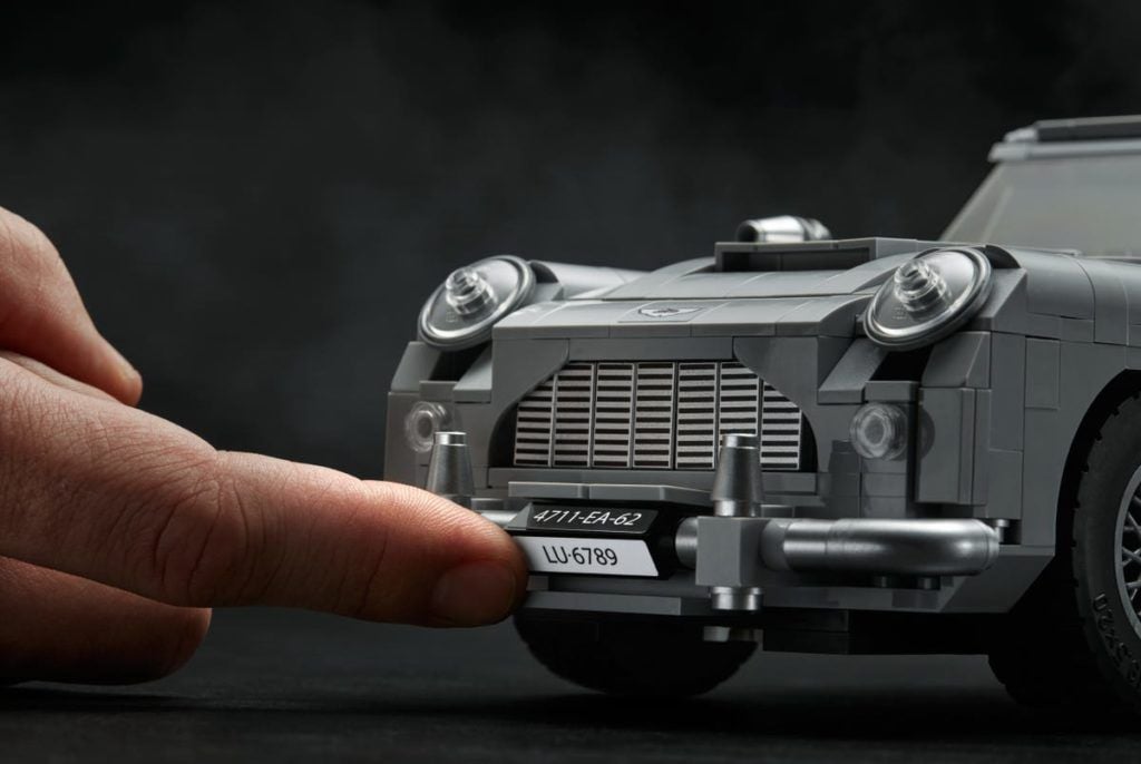 A hand holding a camera
