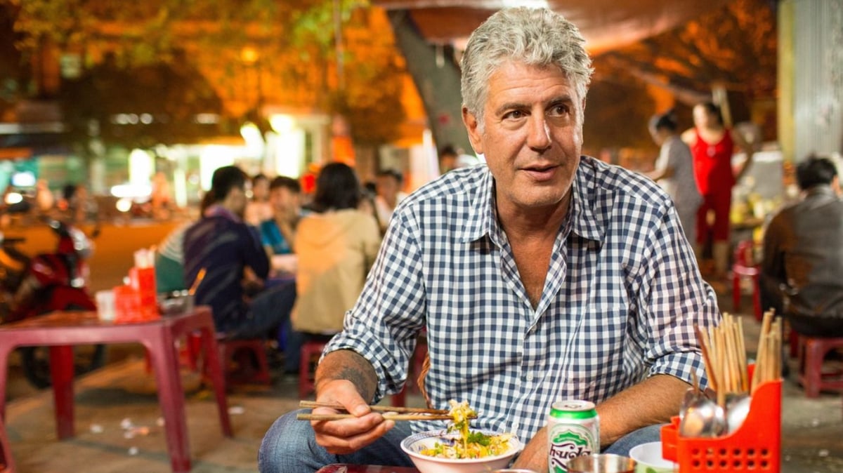 A man sitting at a table in a restaurant