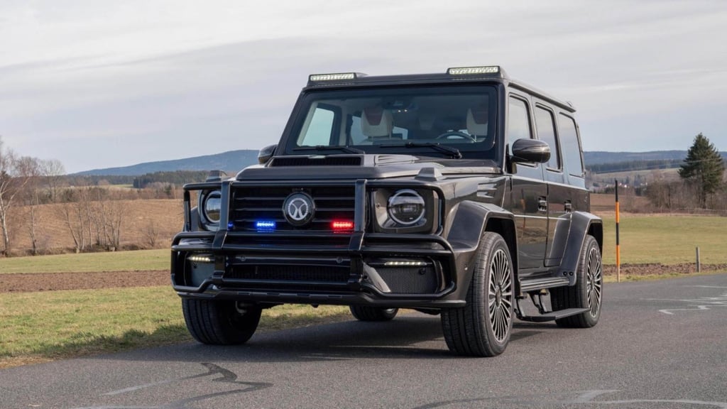 A truck that is driving down the road