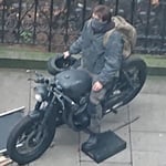 A person sitting on a motorcycle