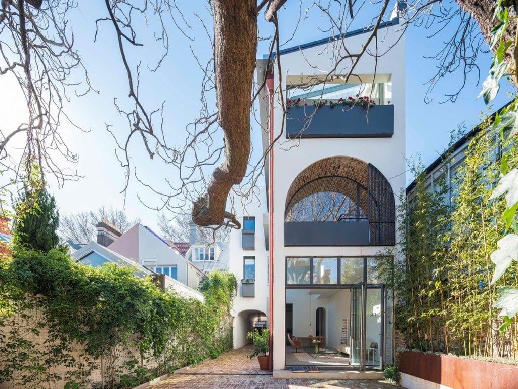 A tree in front of a building