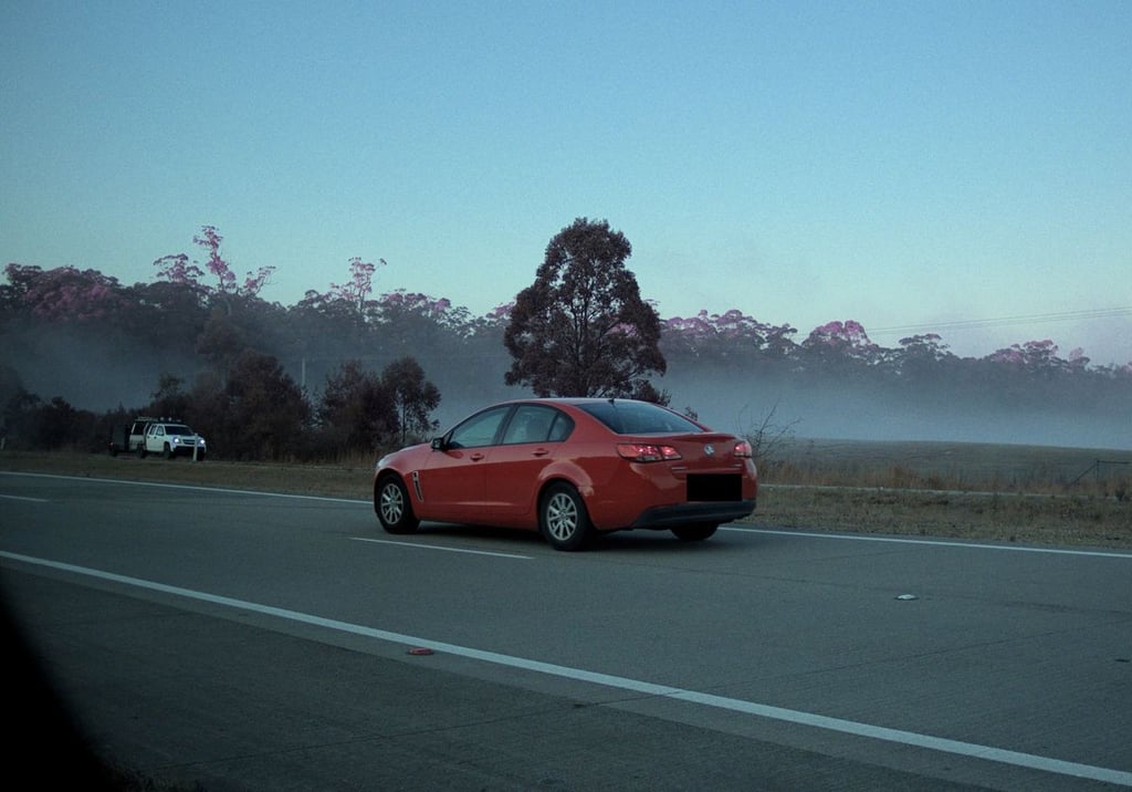 A car parked on the side of a road