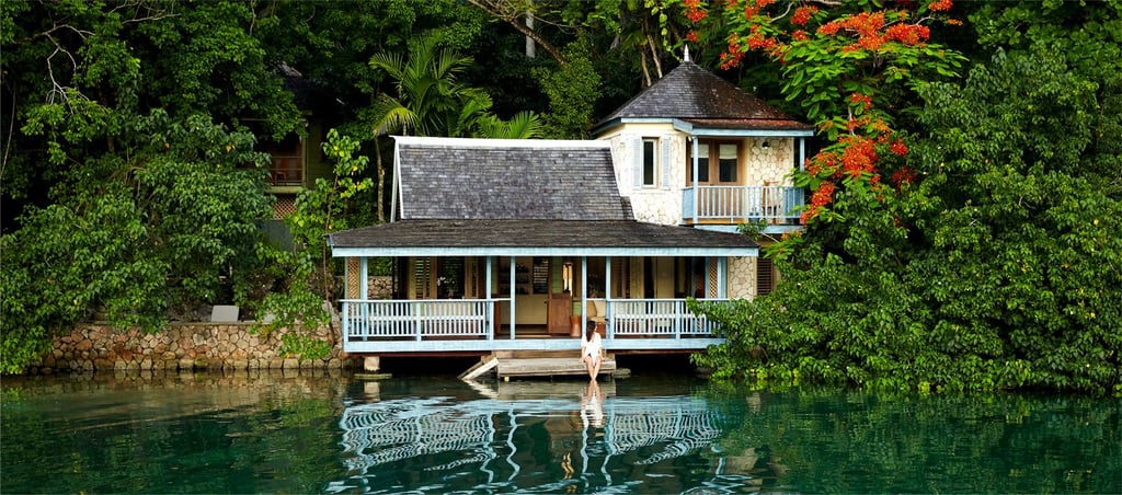 A house with a boat in the water