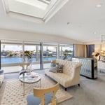 A living room filled with furniture and a large window