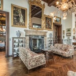 A living room filled with furniture and a fire place