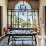 A living room filled with furniture and a large window