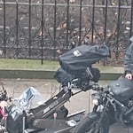 A man riding on the back of a motorcycle