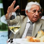 A man sitting at a table eating food