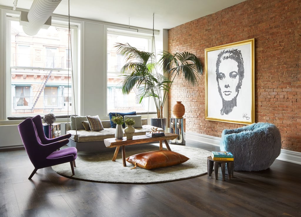 A living room filled with furniture and a large window