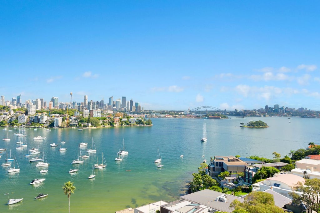 A large body of water with a city in the background