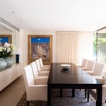 A living room filled with furniture and vase on a table