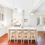 A kitchen with a wood floor