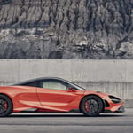 A car parked in front of a mountain