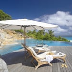 A chair sitting in front of a pool of water