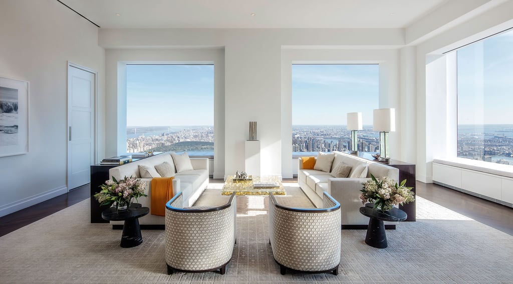 A view of a living room filled with furniture and a large window