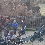 A group of people sitting on a motorcycle