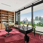 A living room filled with furniture and a large window