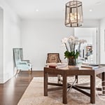 A living room filled with furniture and vase on a table