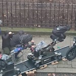 A group of people sitting on a motorcycle