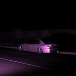 A purple car in the dark