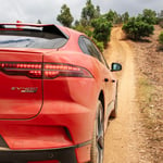 A car parked on a dirt road