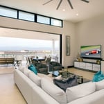 A living room filled with furniture and a large window