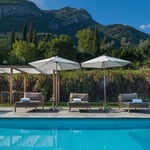 A pool with a mountain in the background