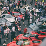 A group of people riding on the back of a car