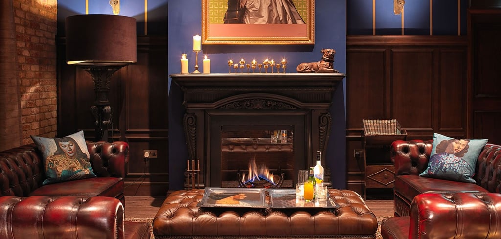 A living room filled with furniture and a fire place