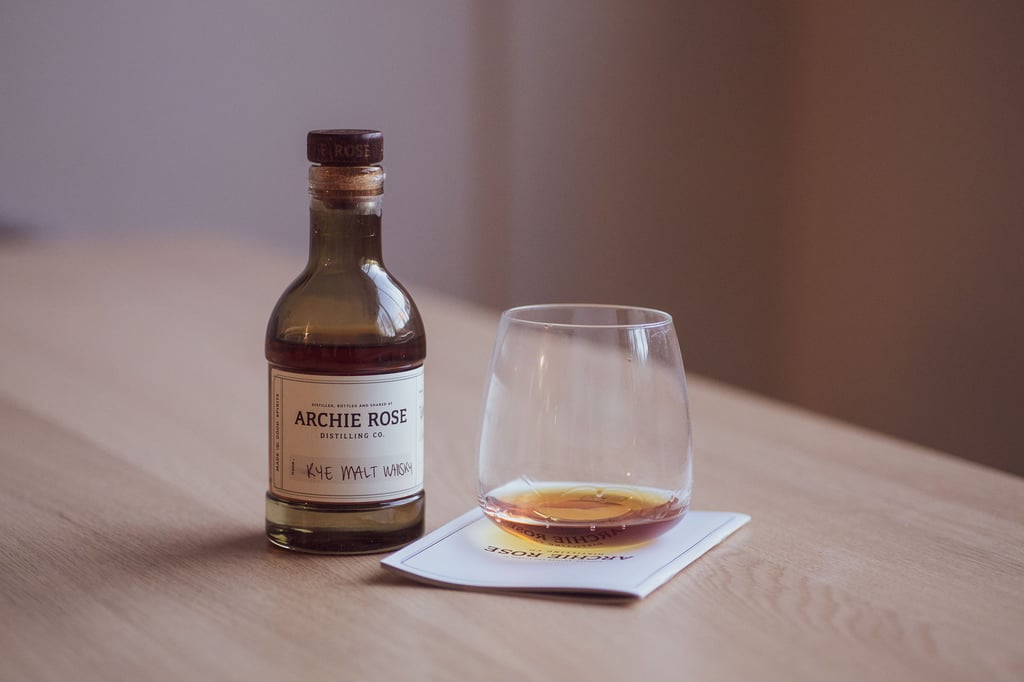 A bottle of wine sitting on top of a wooden table