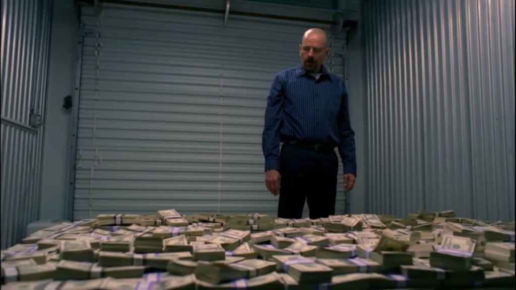 A man standing in front of a cake