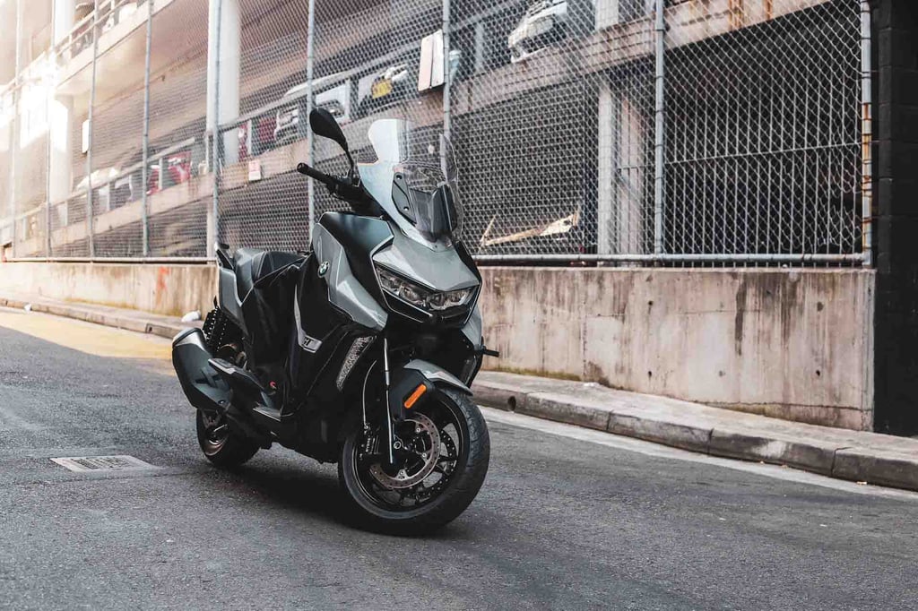 A motorcycle parked on the side of a building