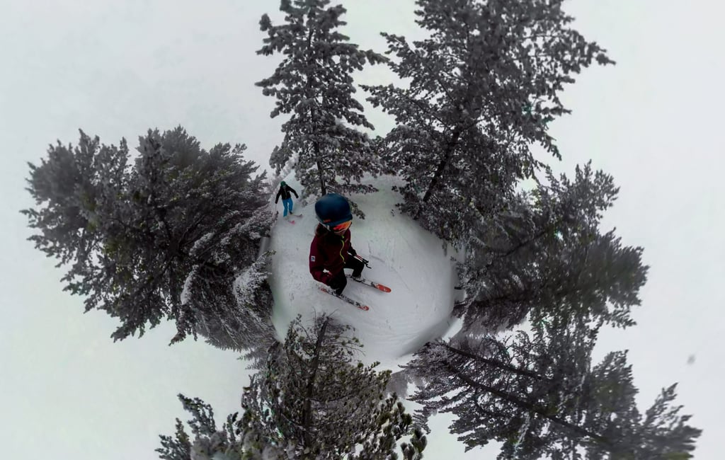 A man flying through the air while riding skis