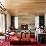 A living room filled with furniture and a fire place