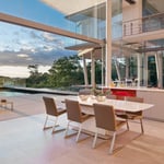 A dining room table in front of a building