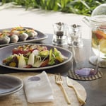 A table topped with plates of food on a plate