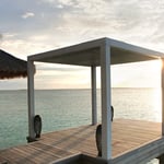 A wooden bench overlooking a body of water