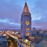 A large clock tower towering over a city