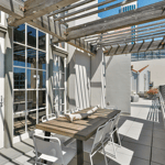 A dining room table in front of a building