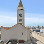 A large clock tower towering over a city