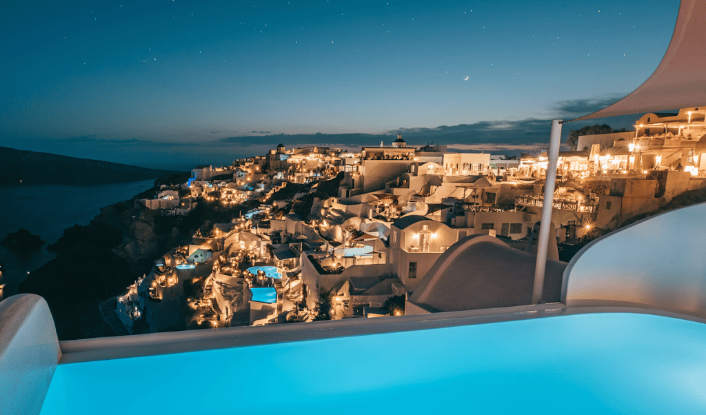 A boat in the water with a city in the background