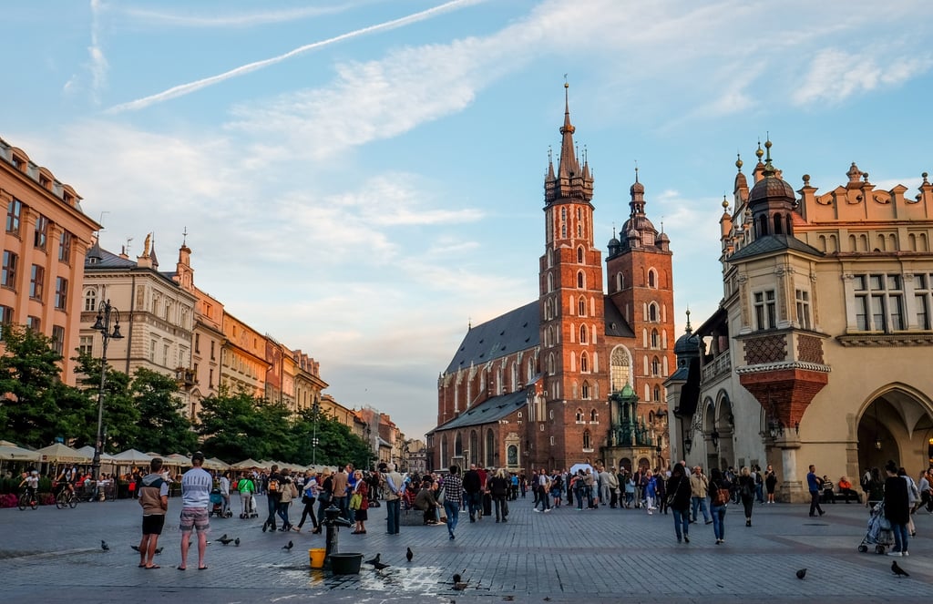 A group of people walking on a city street