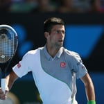 A man holding a racket on a court