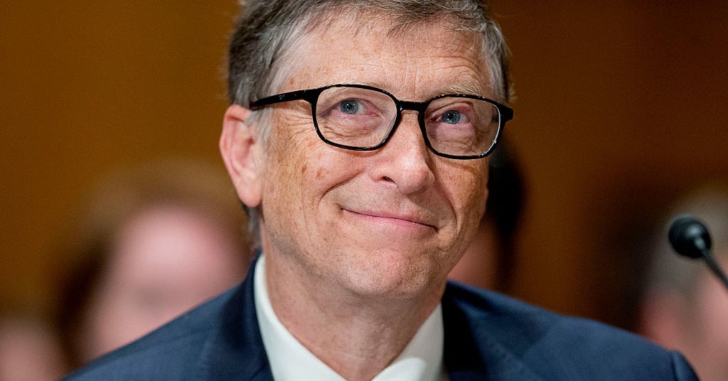 A close up of a man wearing glasses and looking at the camera