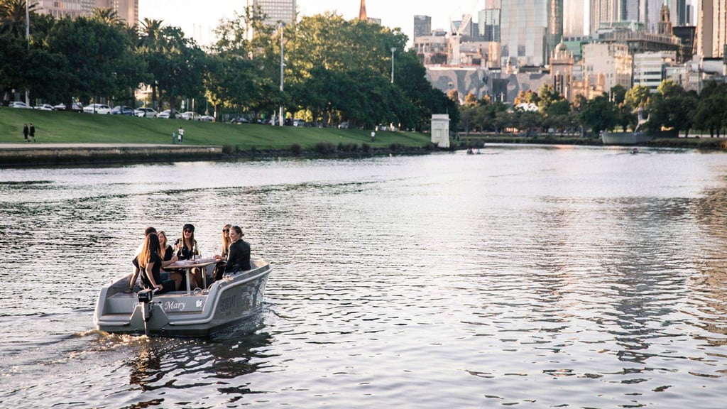 A group of people in a boat on a body of water