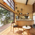 A kitchen with a table and chairs