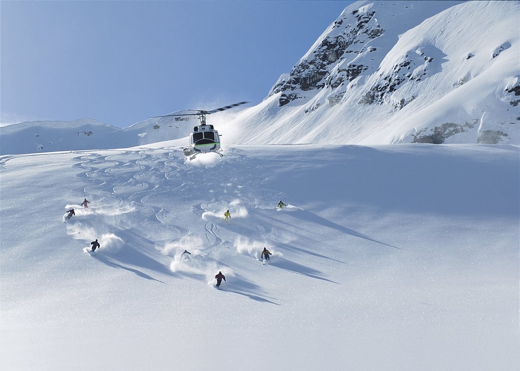 A man skiing down a snow covered slope