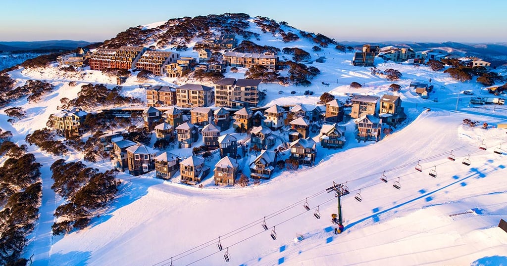 A group of people riding skis on top of a snow covered slope