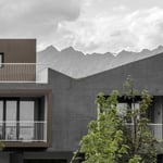 A house with trees in front of a building