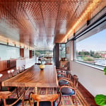 A dining room table in front of a window